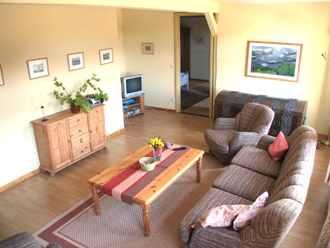 Wohnzimmer der Ferienwohnung  auf dem Ferienhof Baustrup
